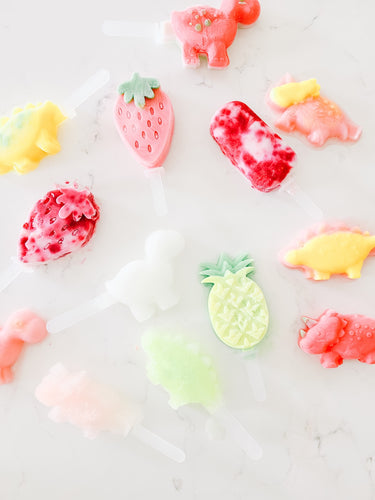 popsicle molds made from silicone in dinosaur and fruit shape